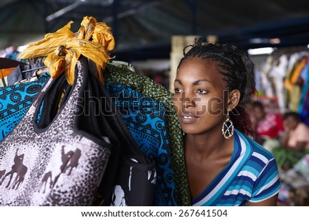 Young woman in a street market in Nairobi (Kenya) Royalty-Free Stock Photo #267641504