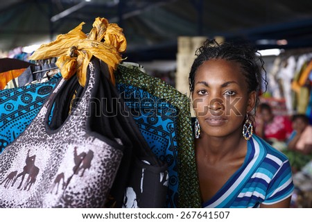 Young woman, looking at the camera, working in a street market in Nairobi (Kenya) Royalty-Free Stock Photo #267641507