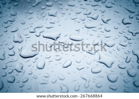 closeup of the water drops on the hood