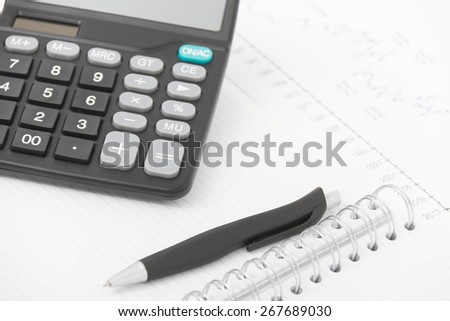 Business concept with calculator, pen and notebook