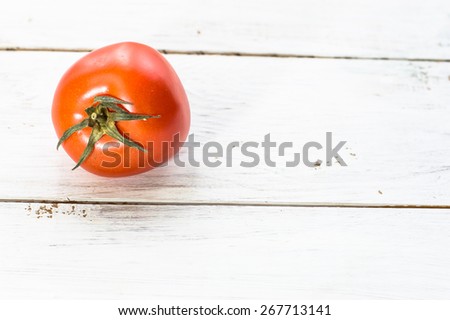 Tomatoes on wood background