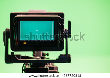 Television Camera in a green screen studio  Royalty-Free Stock Photo #267720818