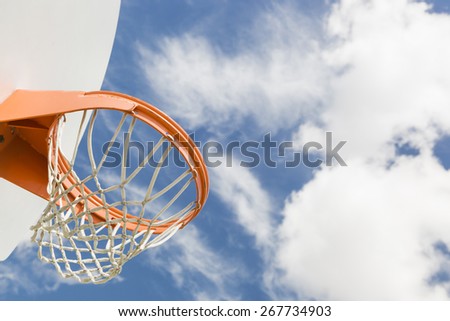 Abstract of Community Basketball Hoop and Net Against Blue Sky.