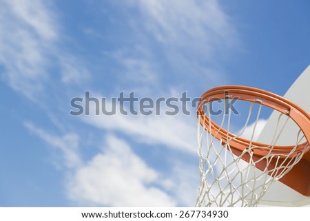Abstract of Community Basketball Hoop and Net Against Blue Sky.