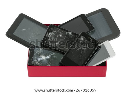 Heap of broken  personal no name mass production electronic gadgets in red paper box. 