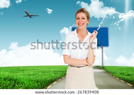 Thinking businesswoman against road leading out to the horizon
