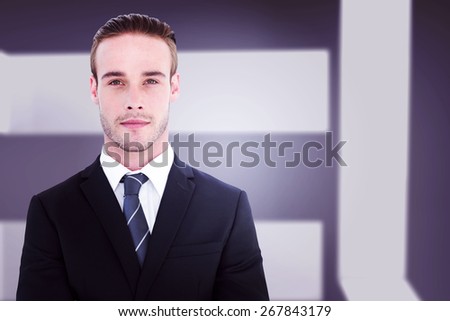 Frowning businessman looking at camera against abstract room