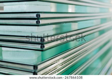 Sheets of Factory manufacturing tempered clear float glass panels cut to size Royalty-Free Stock Photo #267866108