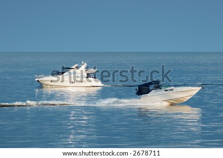 Two white motor boats at sea