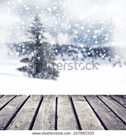 winter background with individual tree and cloudy sky with snowflakes
