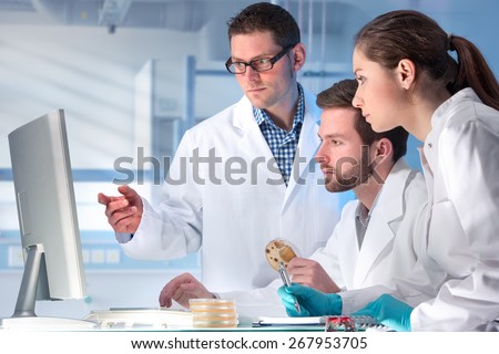 group of scientists working at the laboratory Royalty-Free Stock Photo #267953705
