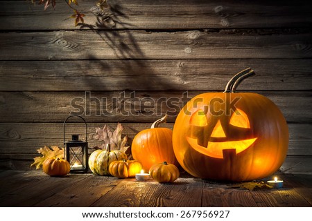 Halloween pumpkin head jack lantern on wooden background