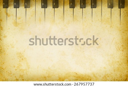 Grunge musical background with music page and the piano keys. Music concept with musical instrument on an old texture background. Piano keys in retro style with copy-space for text at paper texture.