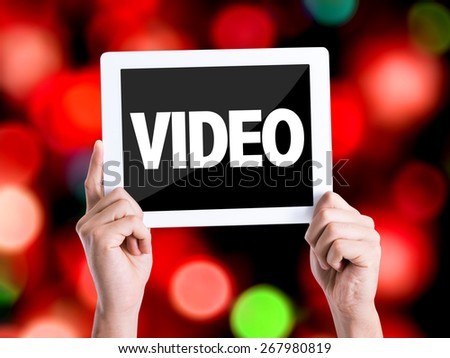 Tablet pc with text Video with bokeh background