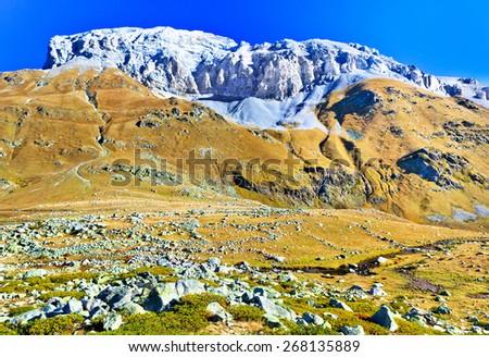 Landscape with white mountain. Picture was taken during trekking hike in splendid mountains of north Caucasus at autumn, Arhiz region, Zagedan range, Karachay-Cherkessia, Russia