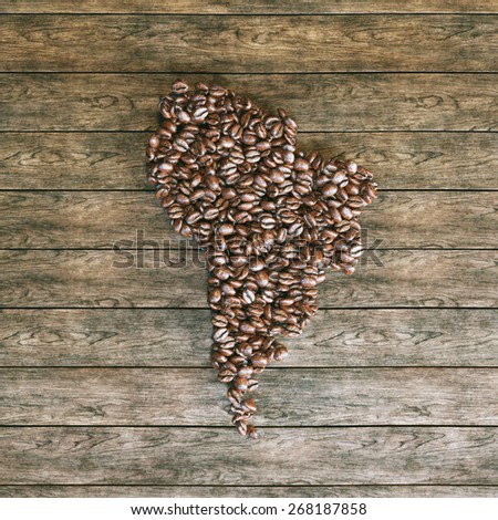 Map of South America made of roasted coffee beans on vintage wooden background 