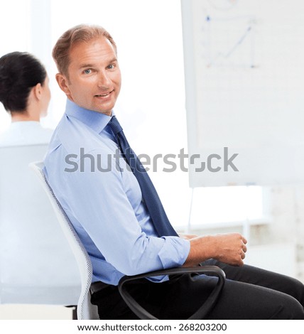 picture of smiling businessman on business meeting in office