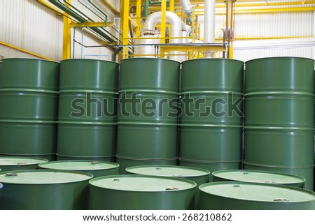 Green barrels or chemical drums stacked up