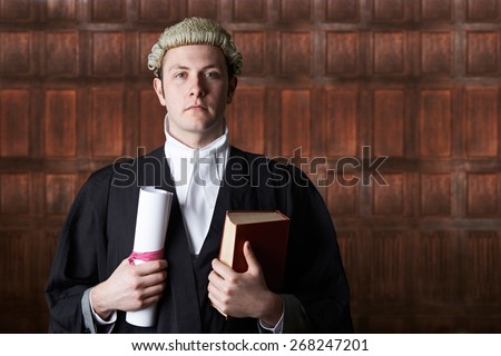 Portrait Of Lawyer In Court Holding Brief And Book Royalty-Free Stock Photo #268247201
