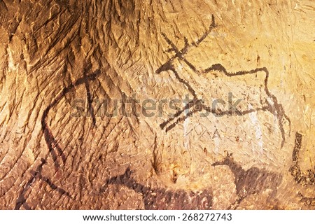 Abstract children art in sandstone cave. Black carbon paint of human hunting on sandstone wall, copy of prehistoric picture.