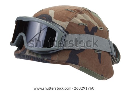 kevlar helmet with a camouflage cover and protective goggles isolated on white background