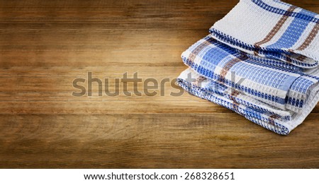 Tablecloth textile on old  rustic wooden background.