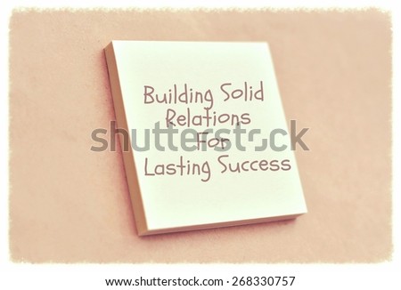 Text building solid relations for lasting success on the short note texture background