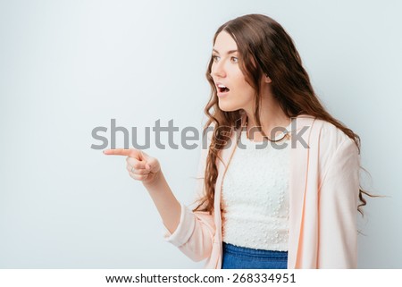 long-haired beautiful young brunette woman pointing her finger