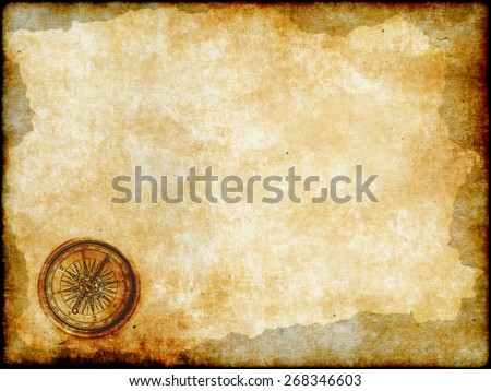 old brass or golden compass with vintage map background, vintage paper background