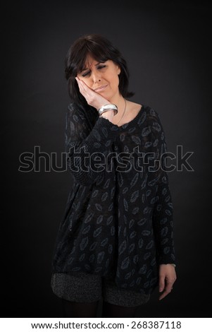 beautiful woman doing different expressions in different sets of clothes: toothache