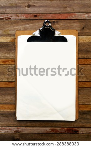 Blank clip on menu on wooden background Royalty-Free Stock Photo #268388033