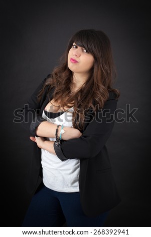 Beautiful woman doing different expressions in different sets of clothes: arms crossed