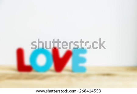 Colorful wooden word Love with white background in Blur style