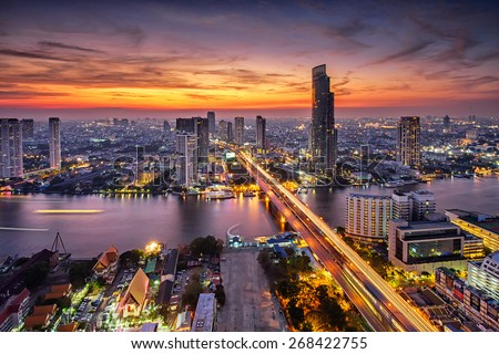 Bangkok city at sunset (Taksin Bridge) Royalty-Free Stock Photo #268422755