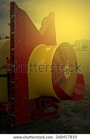 Agricultural equipment in sunset light. Image digitally manipulated.