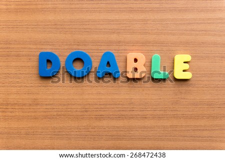 doable colorful word on the wooden background
