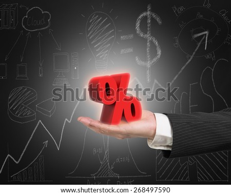 Hand showing 3D red percentage sign with business concept doodles blackboard background