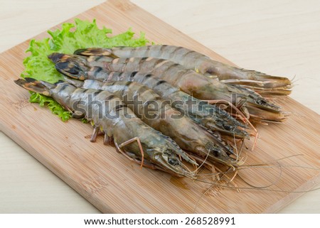 Raw tiger shrimps on the wood board