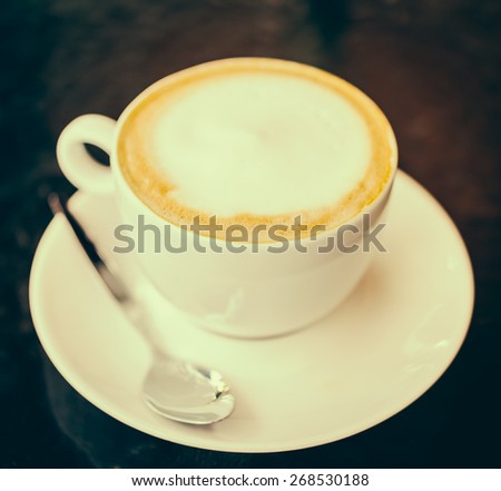 latte coffee in white cup - vintage effect style pictures