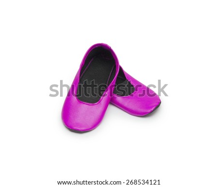 Childrens gym shoes isolated against a white background