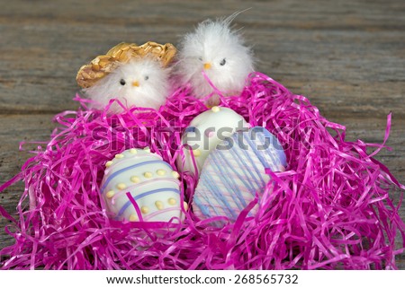 Easter egg cookies with baby chicks in vibrant pint nest