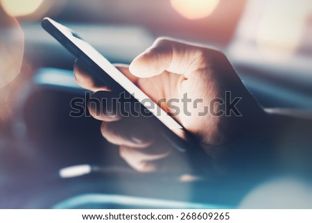 Closeup of hand using smartphone with effects Royalty-Free Stock Photo #268609265