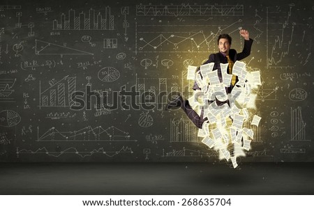 Handsome businessman jumping with paper document cloud around him