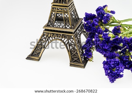 eiffel tower model and Statice flower isolated on white