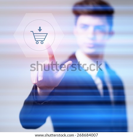 business, technology and internet concept - businessman pressing cart button on virtual screens