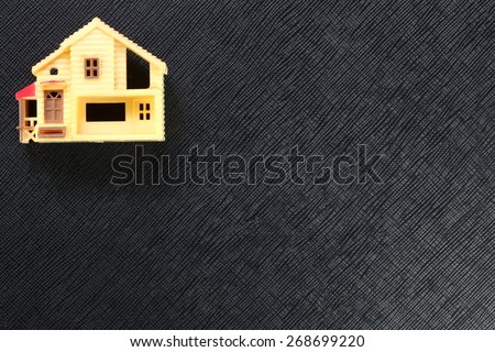 The old and vintage rural style of miniature plastic house model represent the mortgage concept related idea.