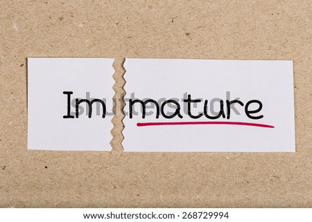Two pieces of white paper with the word immature turned into mature