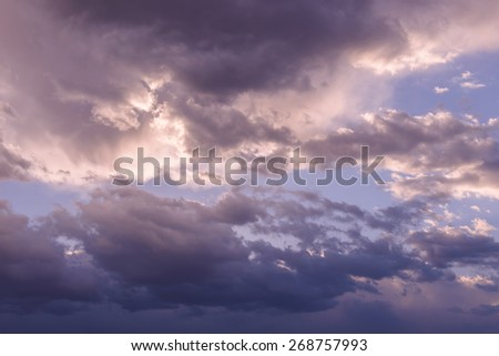 Purple clouds on the blue sky