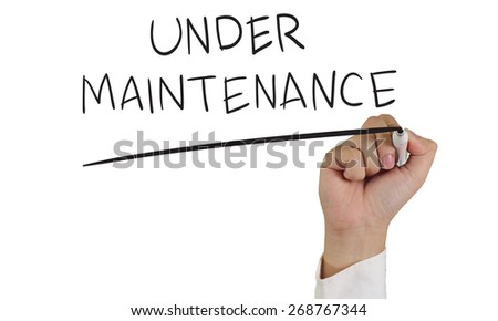 Internet concept image of a hand holding marker and write Under Maintenance isolated on white