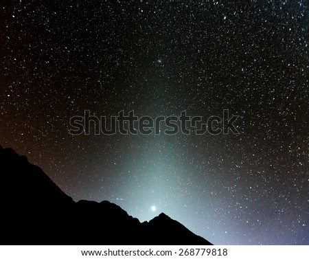 Zidiacal light and starry sky on background Machhapuchre and Annapurna Base Camp - Nepal, Himalayas